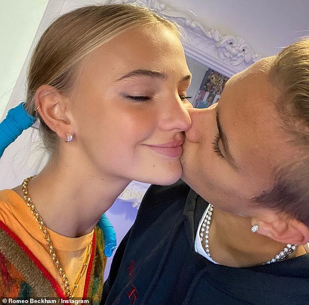 Romeo Beckham Plants A Kiss On The Cheek Of His Girlfriend Mia Regan For An Adorable Loved Up Snap Culture Readsector @ the cramping up asker have you tried doing wrist exercises before you go to draw? culture readsector
